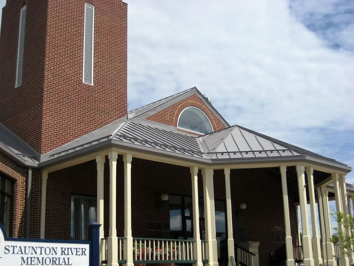 Skilled roofing craftsmen working on a residential roof in Atlantique